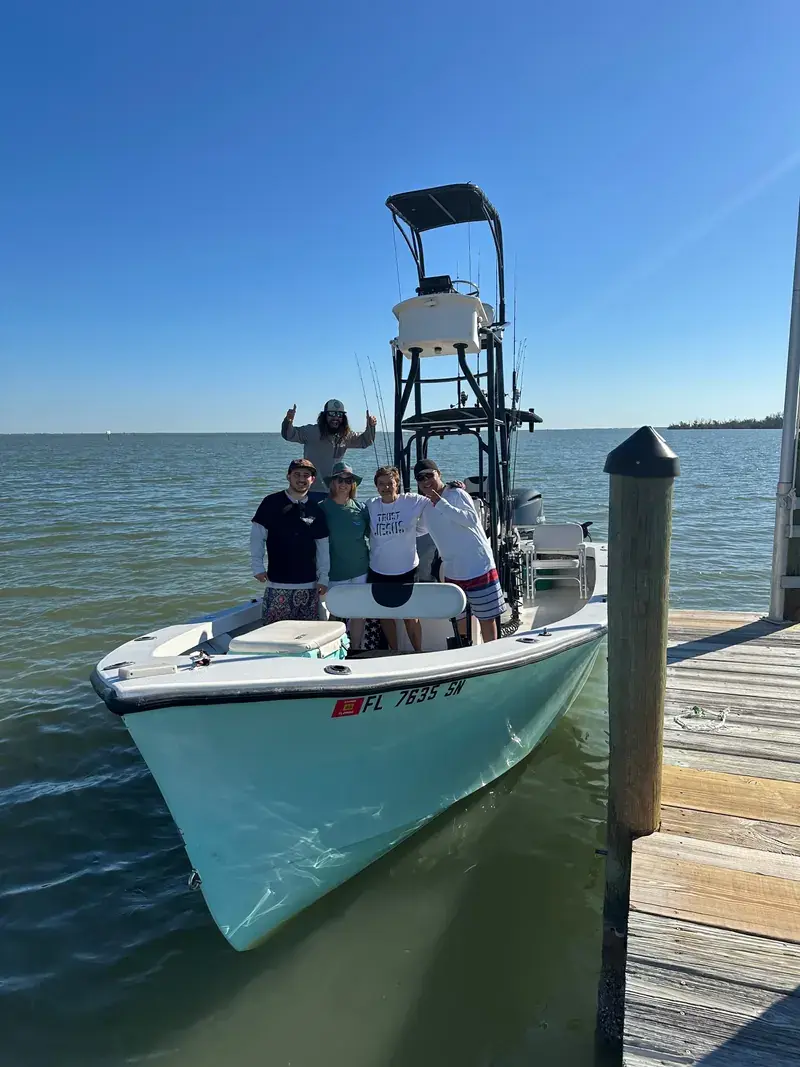 Captain with clients on the boat
