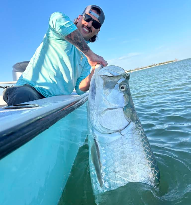 Captain with tarpon catch