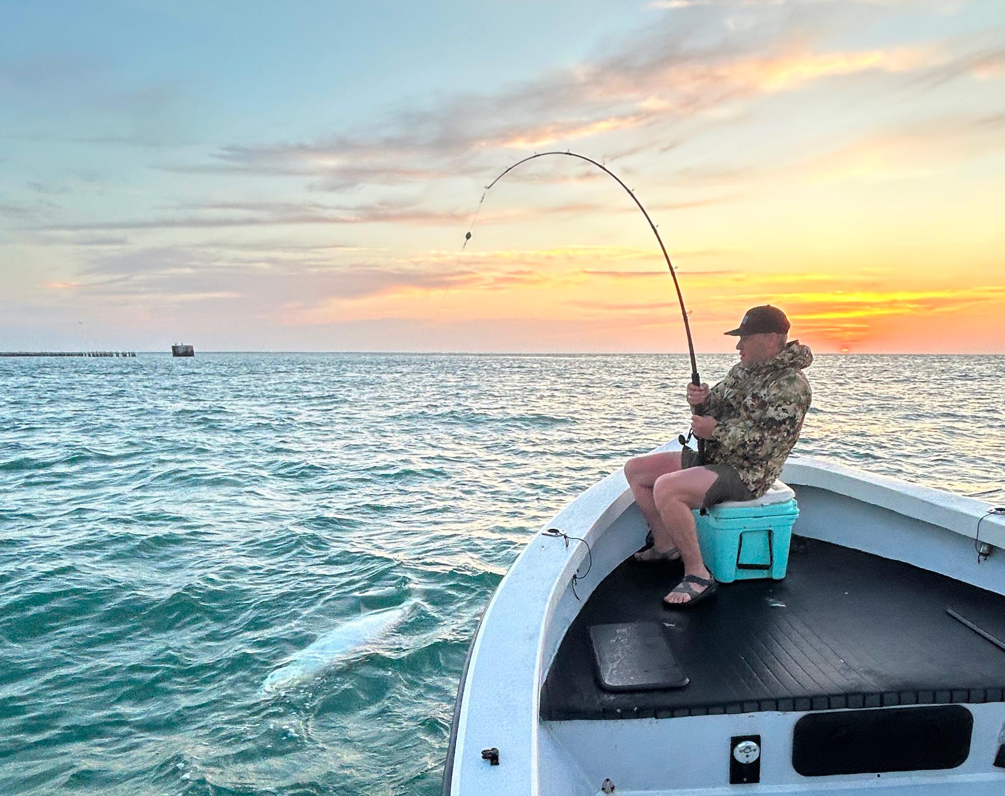 Captain Sean with a snook catch at sunset